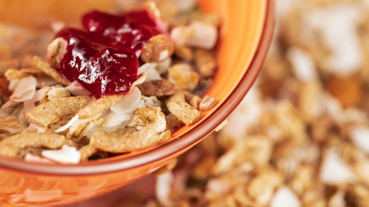 a close up of a bowl of cereal with cranberry sauce